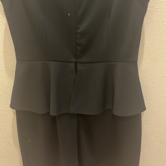 A black formal dress that is very plain and simple. Can be dressed up or down. - Picture 3 of 3